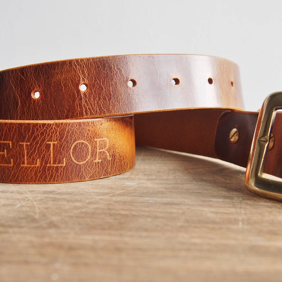 The Personalised Leather Belt with a custom name engraved.