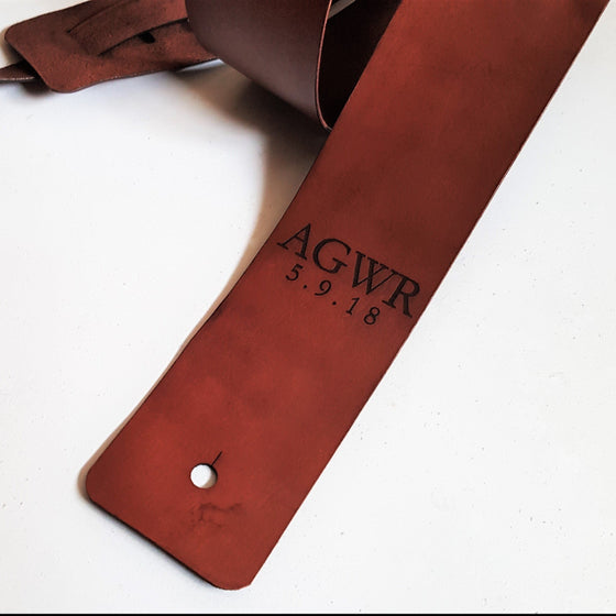 The Personalised Leather Guitar Strap by HÔRD featuring a personalised initial and date.
