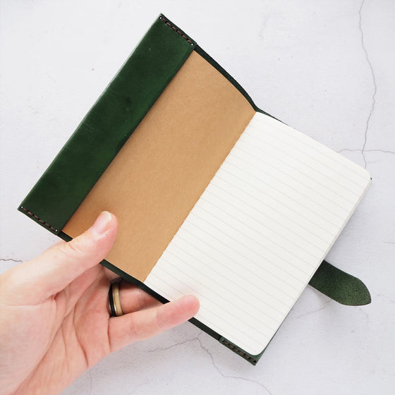 The A6 leahter notebook cover bound onto a moleskine cahier.