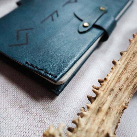 Doubly hand stitched using waxed linen thread on the Viking Rune Pocket Journal by HÔRD.