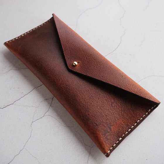The Rust Leather Pencil Case has been hand-stitched for perfection.