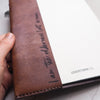 Custom personalised text on the inner sleeve of a leather journal cover of The Fern Leaf Leather Journal Cover by Hôrd.