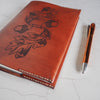 The Acorn notebook by HÔRD featuring oaknut and leaf engraving.