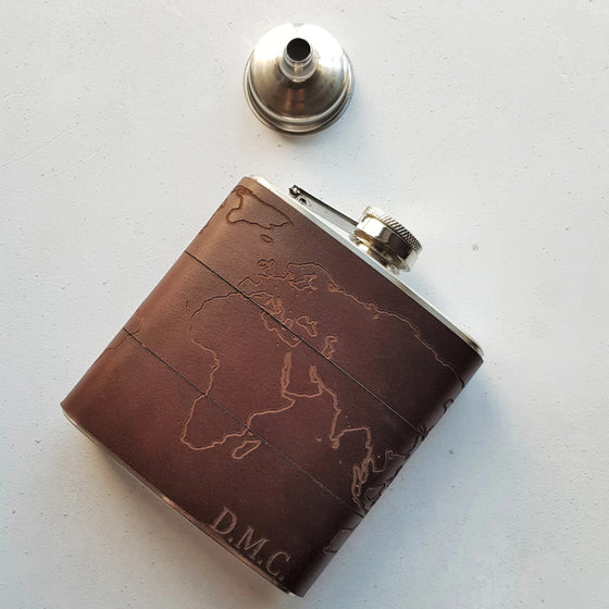 This Map Hip Flask has been personalised with an engraving of a custom initial on the bottom right corner.