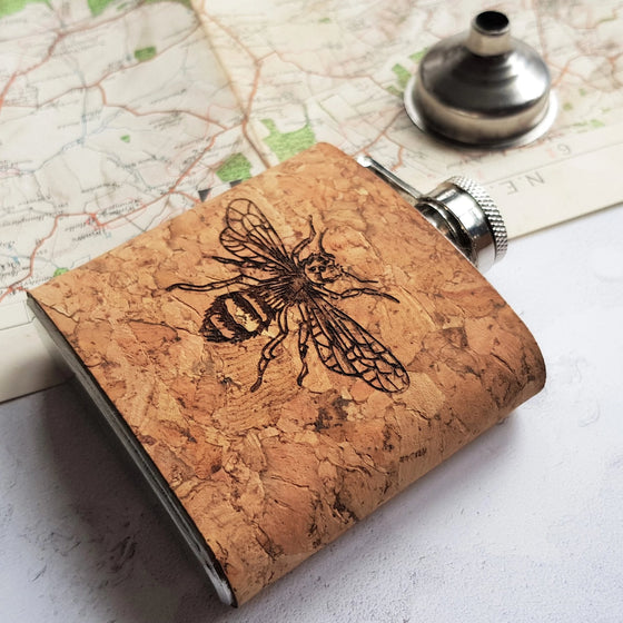 This a custom liquor flask has been made from cork and clad onto a stainless steel hip flask.