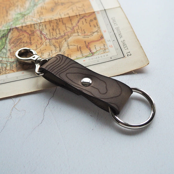 A personalised leather key fob with the engraving of Ben Nevis. This leather key fob can be personalised with a custom place of your choice.