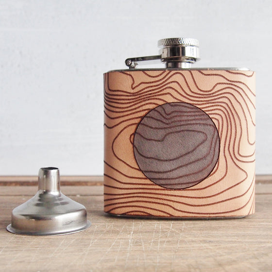 This Scottish Flask is handcrafted from luxurious leather and engraved with the topographic lines of Ben Nevis.