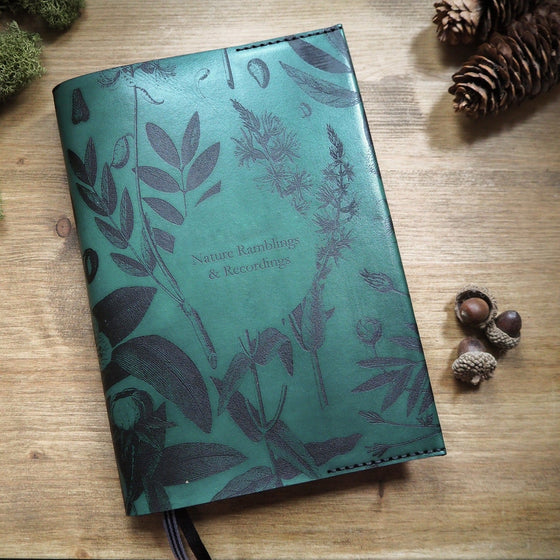 The Garden Journal by Hôrd in Green leather colour and black stitch colours with a custom text in the middle. 