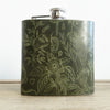 This floral hip flask is hand engraved with illustrations inspired from nature.