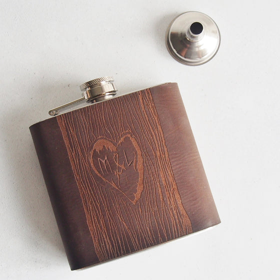 This heart hip flask shows two custom letters carved onto the hip flask.