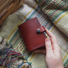 This personalised leather purse, the Compact Mountain Purse has been hand dyed and hand stitched.