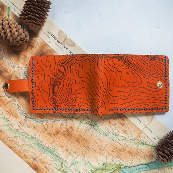 A custom map engraving on the personalised wallet with coin pocket.