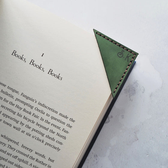 A Corner Bookmark hand dyed in green colour and engraved with custom initials.