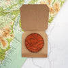 The patch of the custom topography leather adventure bottle packed seperately.