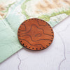 A leather patch which shows part of your topographic location.