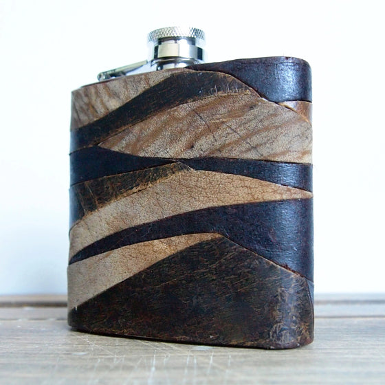 This leather hunting flask  is handcrafted from luxurious British leather remnants.