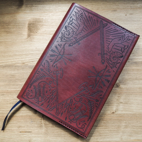 A leather bound A5 journal from HÔRD, featuring the Dungeoneers Notebook Cover.
