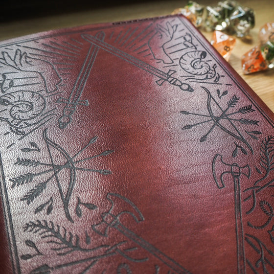Closer look at the engraving of the Dungeoneers Notebook Cover, a leather bound A5 Journal.