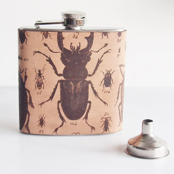 This designer flask is handcrafted in high quality leather and engraved with the illustration.