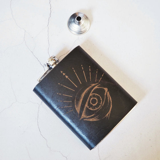 This custom whiskey flask features an engraving of the eye of Odin.