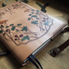 Personalised leather journal cover that's handcrafted; hand-dyed, hand-stitched, and hand painted. The Forager Leather Journal Cover Deluxe by Hôrd.