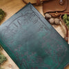 Close-up view of the Forager leather journal cover by HÔRD featuring an illustration inspored by nature. 