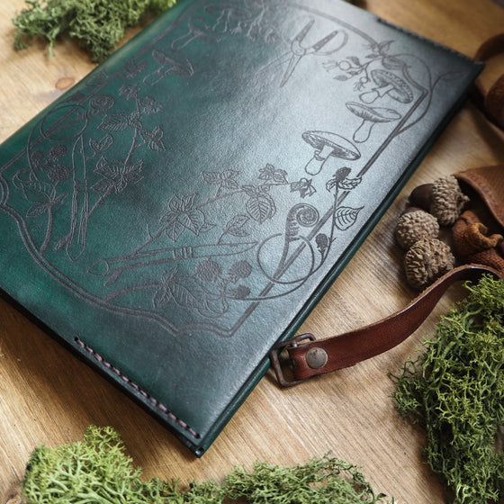 A personalised journal, the forager journal hand dyed in green leather colour and black stitch colour.