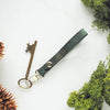 The Lykill Leather Key Ring on green leather colour and custom initials engraved. 
