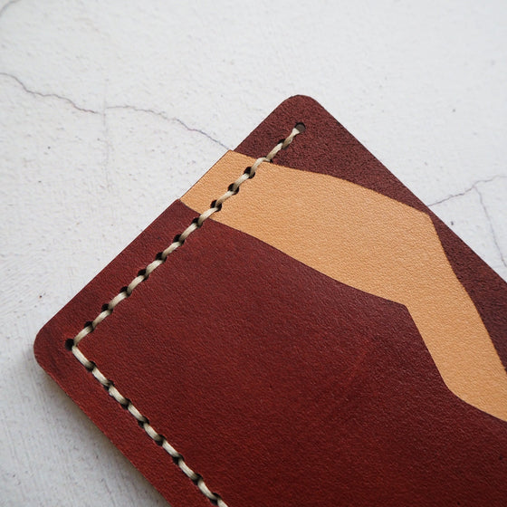 The Misty Mountain Card Holder hand stitched using waxed linen thread.