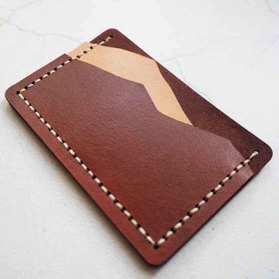 The Misty Mountain Card Holder has been hand dyed and hand stitched at our studio.