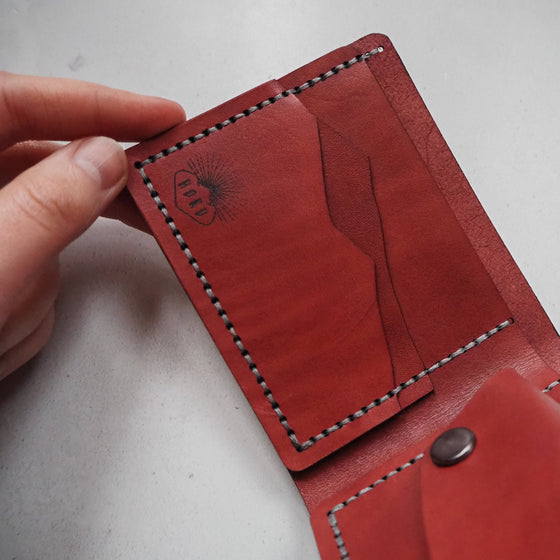 This personalised leather wallet with coin pocket has 2 card compartments which can hold at least 4 cards each.