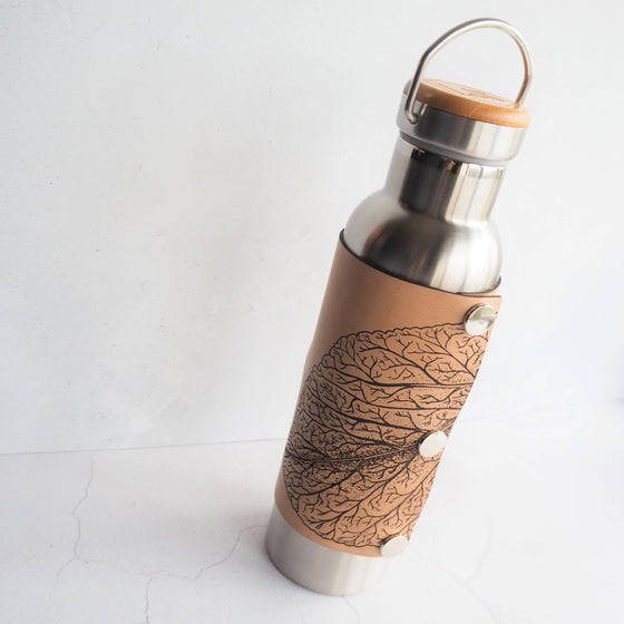 Closer view of the engraving of the Mulberry Leaf Adventure Bottle.