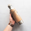 The Mulberry Leaf Adventure Bottle by Hord, leather wrapped insulated water bottle