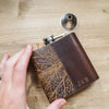 This custom engraved flask is personalised with an initial on the bottom right corner.