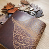 This custom engraved flask is engraved with a mulberry leaf design on brown leather colour.
