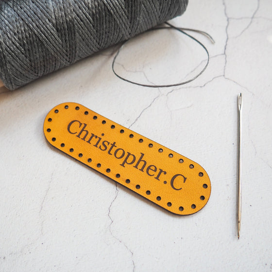 This personalised leather patch has been personalised with a custom name.
