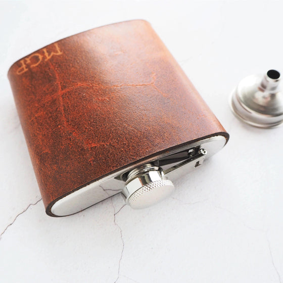 The Rust Leather Flask is engraved with your initials to craft the perfect personalised whiskey flask.