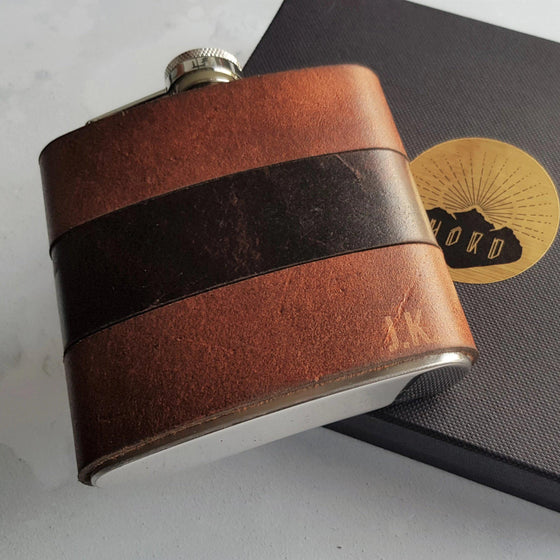 The Rust and Peat Leather Flask is made from leather remnants and makes the perfect gift.