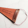 The secret message on the back of the small nursery pennant, a perfect keepsake for new parents to display on the nursery wall. The perfect leather decor by Hord.