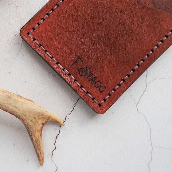 This personalised credit card holder has been hand stitched with waxed linen thread.