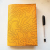 The Topography Journal Cover by HÔRD featuring contour lines. 
