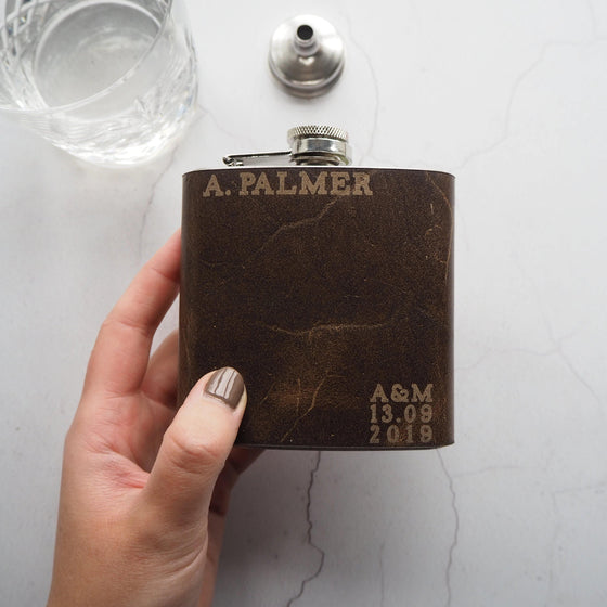 Personalised Wedding Hip Flask that has been engraved with a custom name, custom initials, and date.