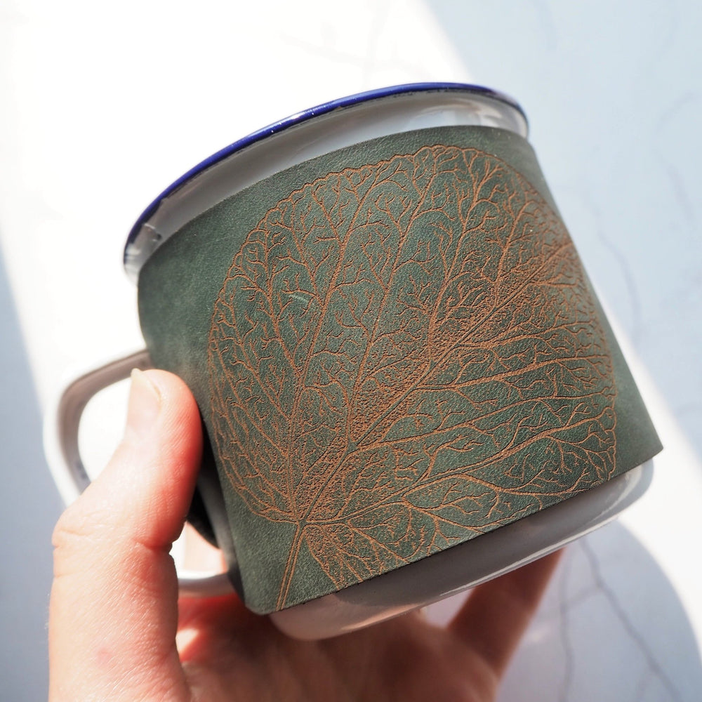 
                  
                    Intricate and fine detailing of the mulberry leaf engraving on the camping enamel mug.
                  
                