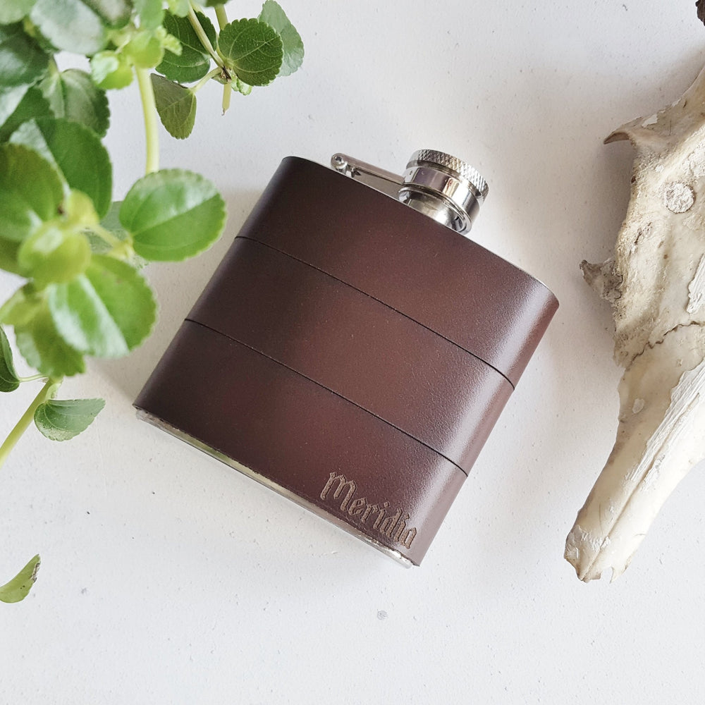 
                  
                    Custom Waxed Brown Leather Flask with a name engraved on the bottom right corner.
                  
                