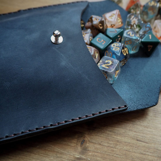 The DnD dice pouch that has been hand stitched with a double waxed black stitch.