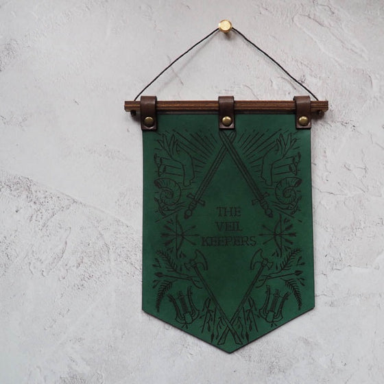 A DnD Decorations banner that's hand dyed leather banner featuring the Dungeoneers design from HÔRD.