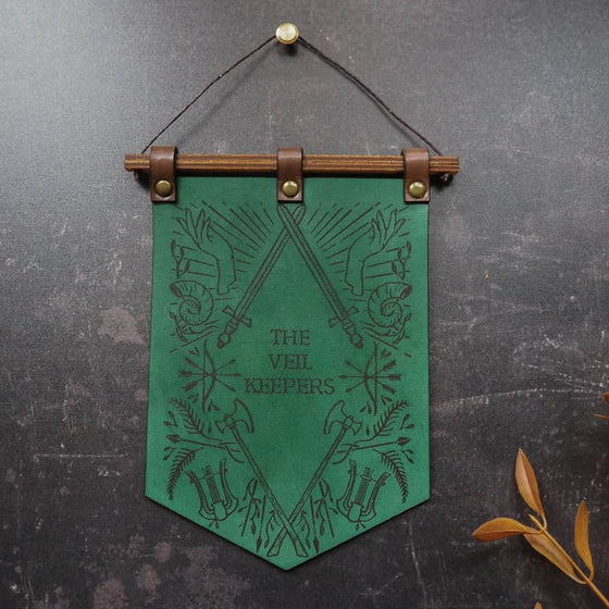 The Dungeoneers Banner, a DnD Decorations banner with a custom text in the middle in green leather colour!