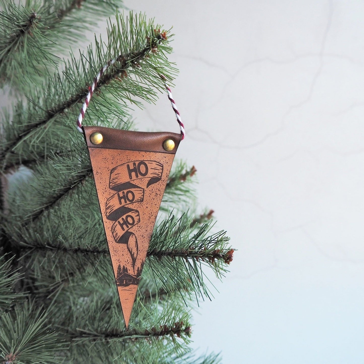 The Ho ho ho Christmas Decoration with log cabin - perfect for your tree and fireplace this Christmas, by Hord.