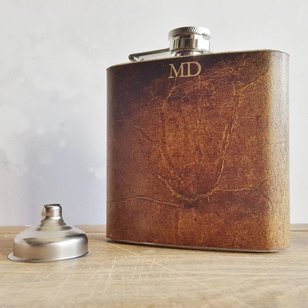 
                  
                    Initialled Oak Leather Flask, a personalised hip flask from Hôrd.
                  
                