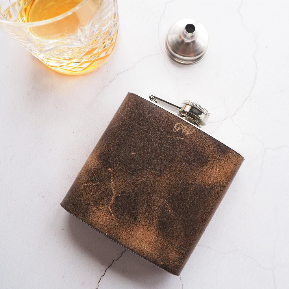 
                  
                    The Initialled Oak Leather Flask that has been engraved with an initial.
                  
                